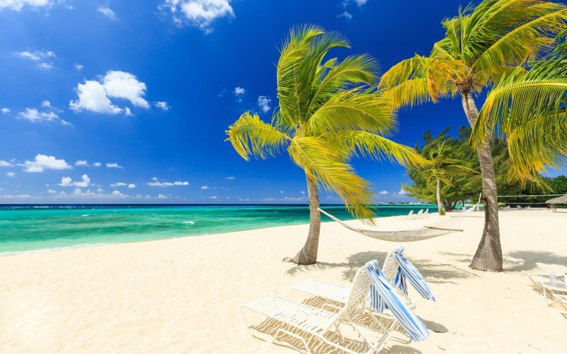 Sunny white sand tropical beach scene, Cayman Islands